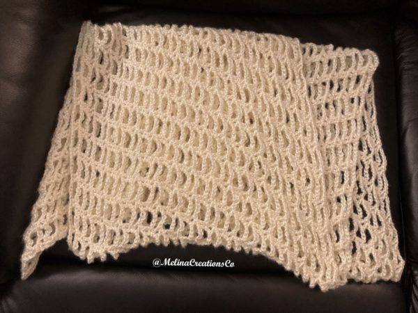 White crochet shawl folded