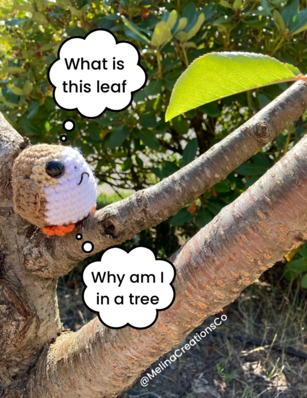 Crochet porg pondering existence in tree