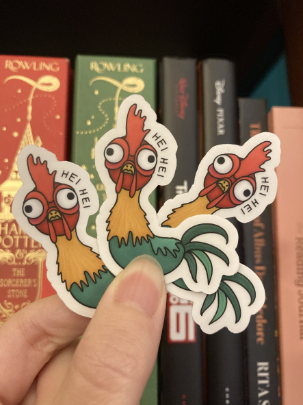 Three displayed Hei Hei stickers